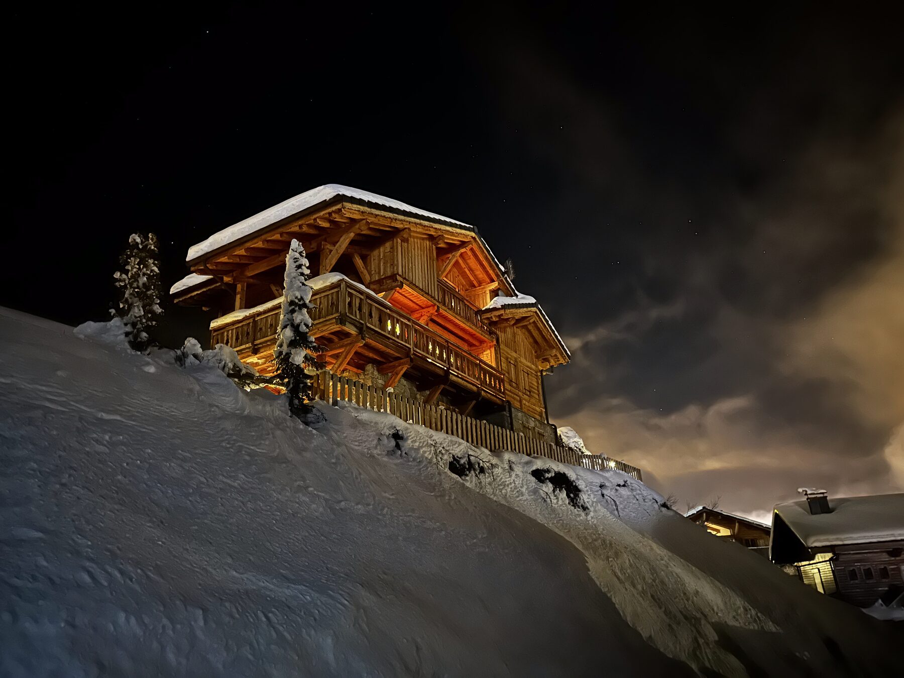 Illuminated chalet at night